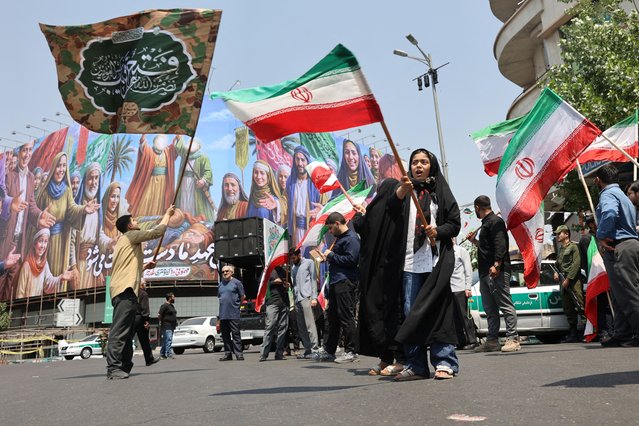 People attend an anti-Israeli protest following the Israeli strikes on Iran, in Tehran, Iran, on June 13, 2025. (Photo by Majid Asgaripour/WANA News Agency via Reuters)