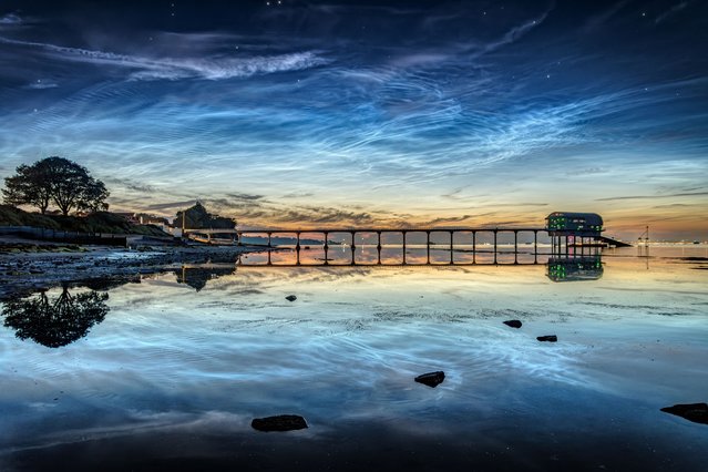 High-altitude noctilucent clouds gleam in the midnight sky above Bembridge, Isle of Wight, UK on July 2, 2025. (Photo by IslandVisions/Bournemouth News)