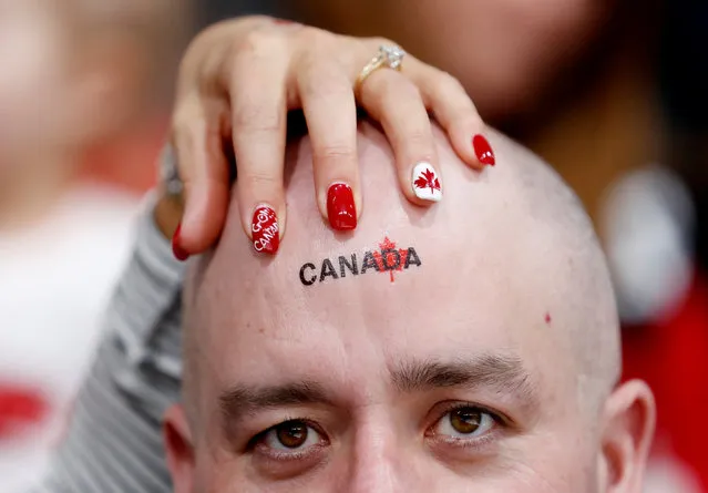 Canada fan watches the match during the curling men's bronze medal game between Canada and Switzerland during the Pyeongchang 2018 Winter Olympic Games at the Gangneung Curling Centre in Gangneung on February 23, 2018. (Photo by Cathal McNaughton/Reuters)