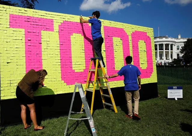 Attendees put the final touches on a TO DO display on the South Lawn of the White House for the South by South Lawn Festival of ideas, arts, and action in Washington, U.S., October 3, 2016. (Photo by Gary Cameron/Reuters)