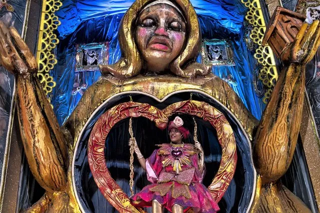 An performer from the Viradouro samba school parades on a float during Carnival celebrations at the Sambadrome in Rio de Janeiro, Brazil, Tuesday, February 21, 2023. (Photo by Bruna Prado/AP Photo)