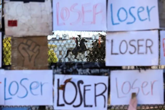 The White House is seen behind posters reading “Loser” the day after the 2020 U.S. presidential election in Washington, U.S. November 4, 2020. (Photo by Erin Scott/Reuters)