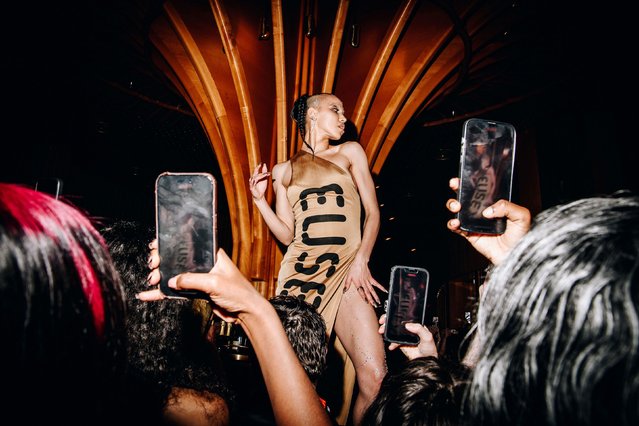People take photos of British singer-songwriter and dancer FKA Twigs at a Met Gala after-party in New York on Monday, May 6, 2024. (Photo by Nina Westervelt/The New York Times/Redux)