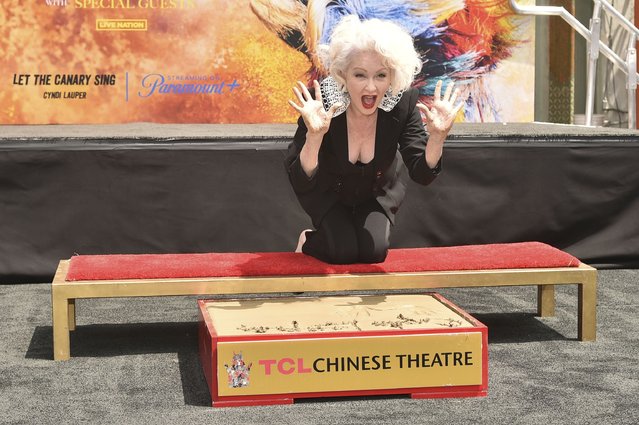 American singer and songwriter Cyndi Lauper poses during a hand and footprint ceremony on Tuesday, June 4, 2024, at the TCL Chinese Theatre in Los Angeles. (Photo by Richard Shotwell/Invision/AP Photo)