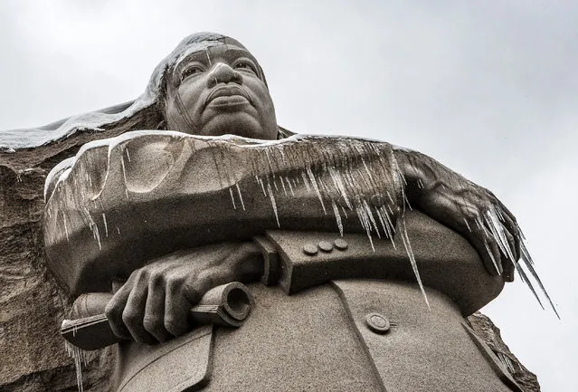 Icicles form on the statue of Rev. Martin Luther King as snow once again blankets the city on March, 17, 2014 in Washington, DC. (Photo by Bill O'Leary/The Washington Post)