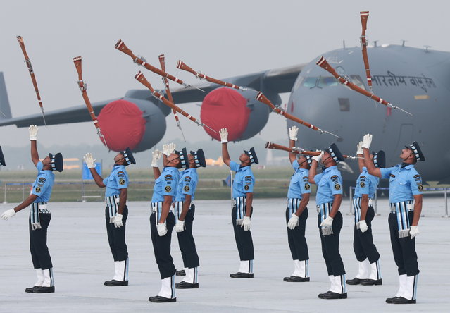 Soldiers from an Indian Air Force drill team display their skills during celebrations marking the 93rd anniversary of the Indian Air Force at the Hindon Air Force Station in Ghaziabad, Uttar Pradesh, India, 08 October 2025. The Indian Air Force marked its 93rd anniversary on 08 October. (Photo by Rajat Gupta/EPA)