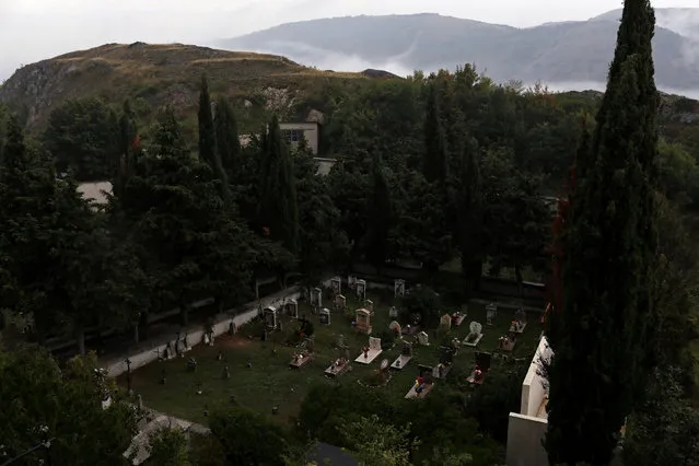 Graves stand in the cemetery of the town of Santo Stefano di Sessanio in the province of L'Aquila in Abruzzo, inside the national park of the Gran Sasso e Monti della Laga, Italy, September 11, 2016. (Photo by Siegfried Modola/Reuters)