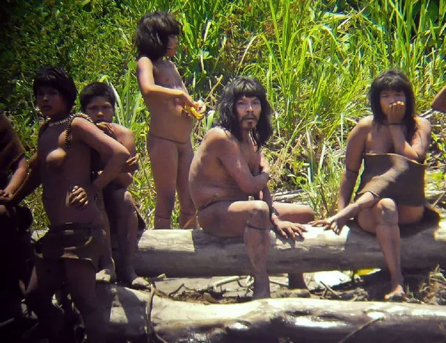 Undated handout picture released by Survival International organization on January 31, 2012 of what they describe as uncontacted members of a family from the Mashco-piro tribe somewhere in the southeastern Peruvian jungle. A native from the Nahua ethnic group was killed and two more wounded in a clash with Masho-piro tribe members, Peru's Culture Ministry informed on November 6, 2016. (Photo by Diego Cortijo/AFP Photo)