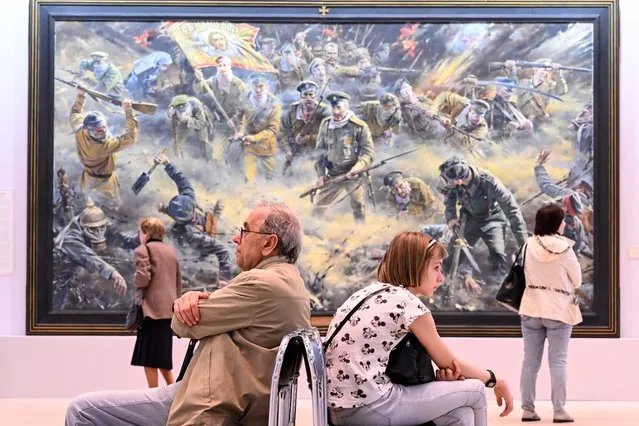 People visit Russian patriotic artist Vasily Nesterenko's exhibition called “We are Russians, God is with us” in Moscow on May 23, 2023. (Photo by Kirill Kudryavtsev/AFP Photo)