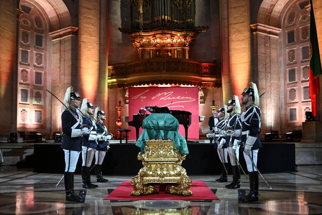 The coffin with the remains of the 19th-century Portuguese novelist Eca de Queiroz is flanked by guards of honour during the transfer ceremony to the National Pantheon in Lisbon on January 8, 2025. Eva de Queiros was born in November 1845 and died on August 1900. (Photo by Patricia de Melo Moreira/AFP Photo)
