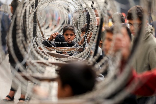Palestinians wait to buy bread, amid a ceasefire between Hamas and Israel, in Gaza City on February 3, 2025. (Photo by Dawoud Abu Alkas/Reuters)