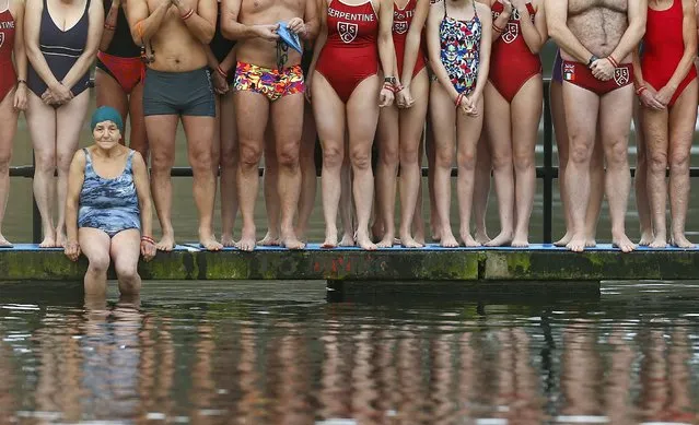 Swimmers prepare to take part in the annual Christmas Day Peter Pan Cup handicap race in the Serpentine River, in Hyde Park, London, December 25, 2015. (Photo by Andrew Winning/Reuters)
