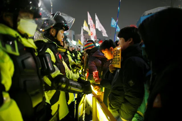 People attend a protest calling for Park Geun-hye to step down on a road leading to the Presidential Blue House in Central Seoul, South Korea, November 26, 2016. (Photo by Kim Kyung-Hoon/Reuters)