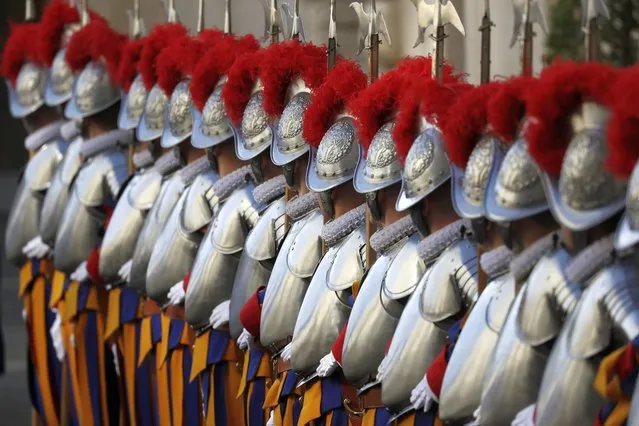 Vatican Swiss Guards stand attention at the St. Damaso courtyard on the occasion of their swearing-in ceremony, at the Vatican, Thursday, May 6, 2021. (Photo by Andrew Medichini/AP Photo)