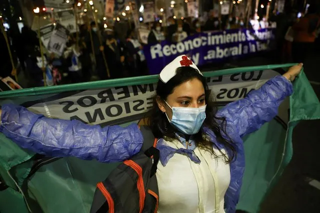 Argentine nurses take part in a march to protest for their working conditions, amid the coronavirus disease (COVID-19) outbreak in Buenos Aires, Argentina on May 12, 2021. (Photo by Matias Baglietto/Reuters)