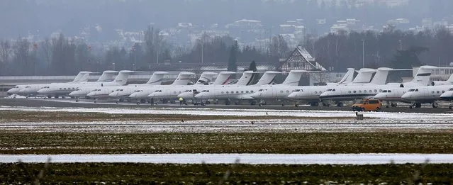Passenger jets are parked at the Swiss Airforce base in Duebendorf, Switzerland January 21, 2016. The airport Duebendorf in Duebendorf is used for arrivals and deprtures of participants of the the annual meeting of the World Economic Forum (WEF) in Davos. (Photo by Arnd Wiegmann/Reuters)