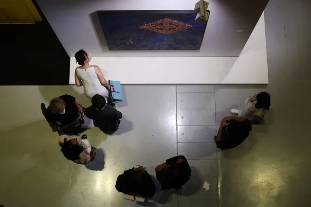Visitors gather around an art work at the Frieze art fair, in Seoul, South Korea on September 2, 2023. (Photo by Kim Hong-Ji/Reuters)