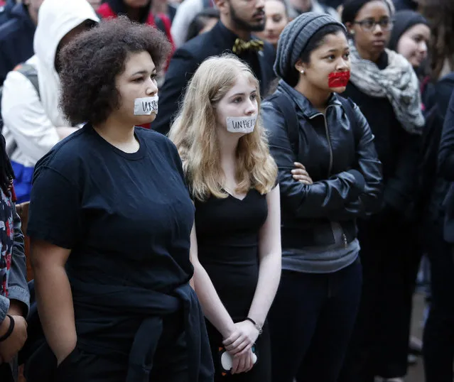 Students at the University of Oklahoma protest racist comments made by a fraternity on Monday, March 9, 2015 in Norman, Okla. University President David Boren lambasted members of Sigma Alpha Epsilon fraternity on Monday who participated in a racist chant caught on video, calling them disgraceful and their behavior reprehensible, and ordered that their house be vacated by midnight Tuesday. (AP Photo/The Oklahoman, Steve Sisney)