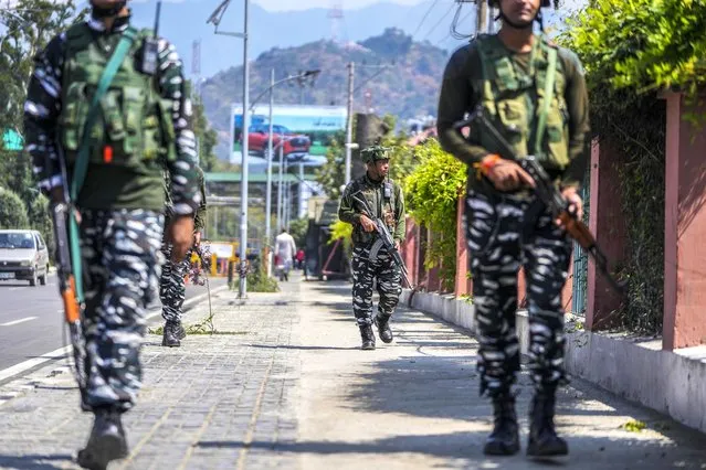 Indian paramilitary soldiers patrol in Srinagar, Indian controlled Kashmir, Tuesday, September 19, 2023. (Photo by Mukhtar Khan/AP Photo)