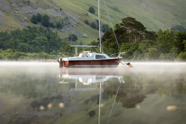 Mist settled on Ullswater in the Lake District, United Kingdom yesterday morning, May 30, 2023, before sunshine broke through. (Photo by Andrew McCaren/London News Pictures)