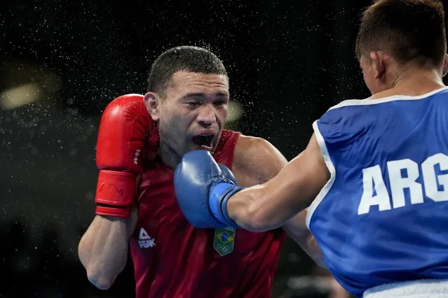Brazil's Michael Da Silva, left, and Argentina's Ramon Quiroga fight in a men's boxing 51kg semifinal at the Pan American Games in Santiago, Chile, Thursday, October 26, 2023. (Photo by Martin Mejia/AP Photo)