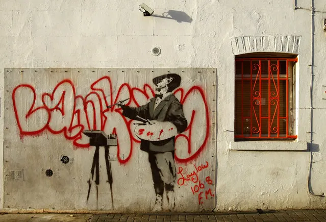 A painting attributed to Banksy on a wall in Portobello Road, west London, in 2008. (Photo by Dylan Martinez/Reuters)