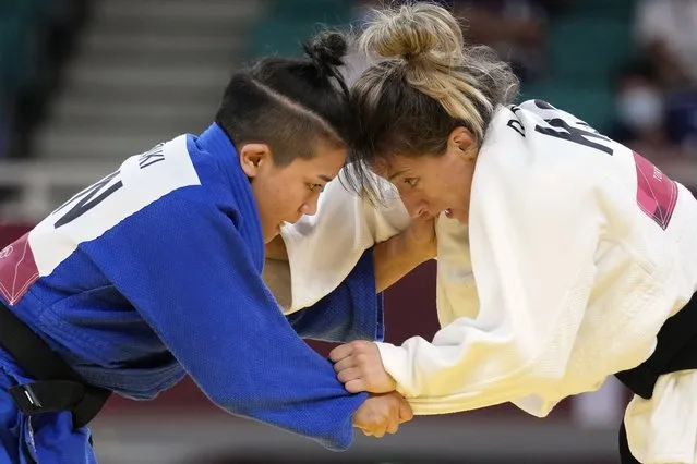 Funa Tonaki of Japan, left, and Distria Krasniqi of Kosovo compete during their women's -48kg championship judo match at the 2020 Summer Olympics, Saturday, July 24, 2021, in Tokyo, Japan. (Photo by Vincent Thian/AP Photo)