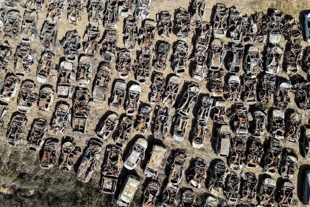 A view of vehicles destroyed by Hamas during the October 7th attack on Israel, collected in a field near the Israel-Gaza border, Israel on October 30, 2023. (Photo by Ilan Rosenberg/Reuters)