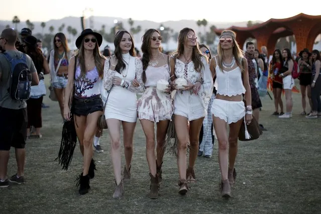 Victoria's Secret model Alessandra Ambrosio of Brazil (C) walks through the Coachella Valley Music and Arts Festival with friends, in Indio, California April 12, 2015. (Photo by Lucy Nicholson/Reuters)