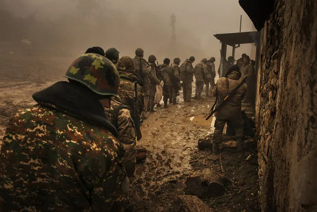 “Armenians – Endangered People”. “I was born in France, but 30 years ago, in a quest for enlightenment, I embarked on a venture to produce a visual rendition of the stories handed down by my grandparents who had escaped the 1915 genocide of the Armenian people”. After a ceasefire, Armenian forces withdraw from their positions. Under the agreement, Russian peacekeeping forces will be deployed for five years, Martuni Province, Nagorno-Karabakh. (Photo by Antoine Agoudjian for Le Figaro Magazine/Visa pour l'Image)