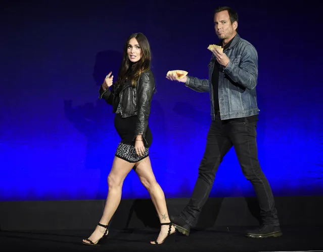Megan Fox, left, and Will Arnett, cast members in the upcoming film “Teenage Mutant Ninja Turtles: Out of the Shadows”, take the stage during the Paramount Pictures presentation at CinemaCon 2016, the official convention of the National Association of Theatre Owners (NATO), at Caesars Palace on Monday, April 11, 2016, in Las Vegas. (Photo by Chris Pizzello/Invision/AP Photo)