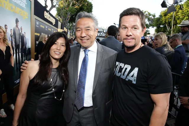 Sandy Tsujihara, Kevin Tsujihara, Chief Executive Officer of Warner Bros. and Mark Wahlberg seen at Warner Bros. Premiere of "Entourage" held at Regency Village Theatre on Monday, June 1, 2015, in Westwood, Calif. (Photo by Eric Charbonneau/Invision for Warner Bros./AP Images)