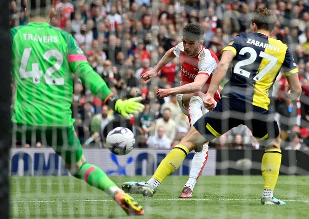 Arsenal's English midfielder #41 Declan Rice scores the team's third goal during the English Premier League football match between Arsenal and Bournemouth at the Emirates Stadium, in London, on May 4, 2024. (Photo by Justin Tallis/AFP Photo)