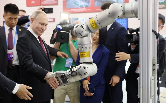 Russian President Vladimir Putin tours an exhibition at the 8th Russian-Chinese EXPO in Harbin, China, on May 17, 2024. (Photo by Mikhail Metzel/Sputnik/Pool via Reuters)