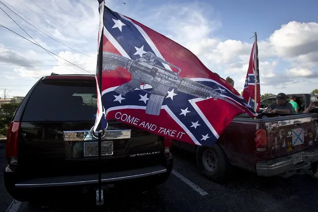 A flag on the back of a SUV flies before for a “Ride for Pride” event to show support for the Confederate flag in Brandon, Hillsborough County, June 26, 2015. (Photo by Carlo Allegri/Reuters)