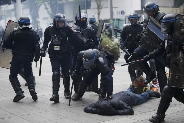 French riot police officers detain a protestor during a demonstration against the French labour law proposal in Nantes, France, as part of a nationwide labor reform protests and strikes, April 28, 2016. (Photo by Stephane Mahe/Reuters)