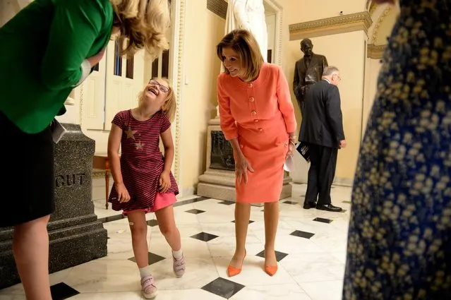 U.S. Speaker of the House Nancy Pelosi (D-CA) greets Rep. Abigail Spanberger (D-VA), and a young visitor (who told Pelosi that she was going to be a member of Congress) at the U.S. Capitol in Washington, U.S., July 25, 2019. (Photo by Mary F. Calvert/Reuters)