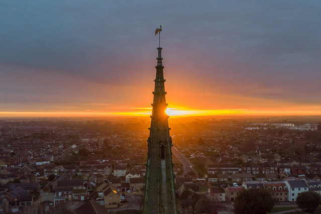 The sun rises this morning behind the 173ft spire of St Mary's church in the market town of Whittlesey in Cambridgeshire, UK on February 17, 2024. The church dates from the 13th century with the Ashlar faced tower added in the 15th century. (Photo by Andrew McCaren/London News Pictures)