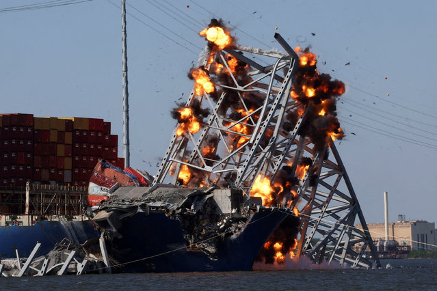 Explosives are detonated to free the container ship Dali, after it was trapped following its collision with the Francis Scott Key Bridge, causing it to collapse, in Baltimore, Maryland on May 13, 2024. (Photo by Leah Millis/Reuters)