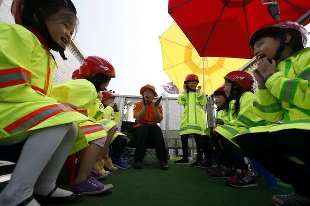 South Korean children are briefed with safety regulations during the Children's Day festival at a war memorial in Seoul, South Korea, 05 May 2016. South Korea marks Children's Day yearly on 05 May, highlighting children's dignity and their need for love and care. (Photo by Jeon Heon-Kyun/EPA)