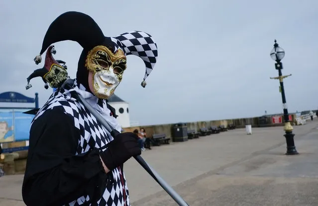 Gabriel Simpson, 16, from York dresses as a Jester during the Goth weekend on April 26, 2014 in Whitby, England. The Whitby Goth weekend began in 1994 and happens twice each year. Thousands of extravagantly dressed people who follow Steampunk, Cybergoth, Romanticism or Victoriana visit the town to take part in the celebration of Goth culture. (Photo by Ian Forsyth/Getty Images)