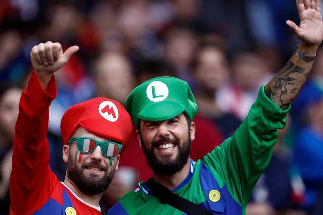 Italy's supporters dressed as Mario and Luigi pose for pictures before the start of the UEFA Euro 2024 Group B football match between Spain and Italy at the Arena AufSchalke in Gelsenkirchen on June 20, 2024. (Photo by Kenzo Tribouillard/AFP Photo)