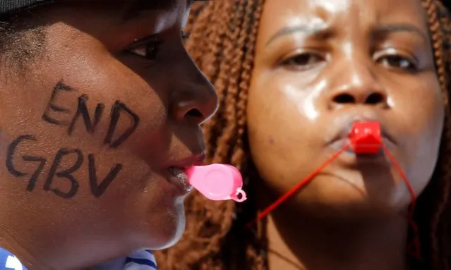Members of the civil society blow whistles as they demonstrate against gender-based violence to mark International Women's Day in downtown Nairobi, Kenya, March 8, 2022. (Photo by Monicah Mwangi/Reuters)