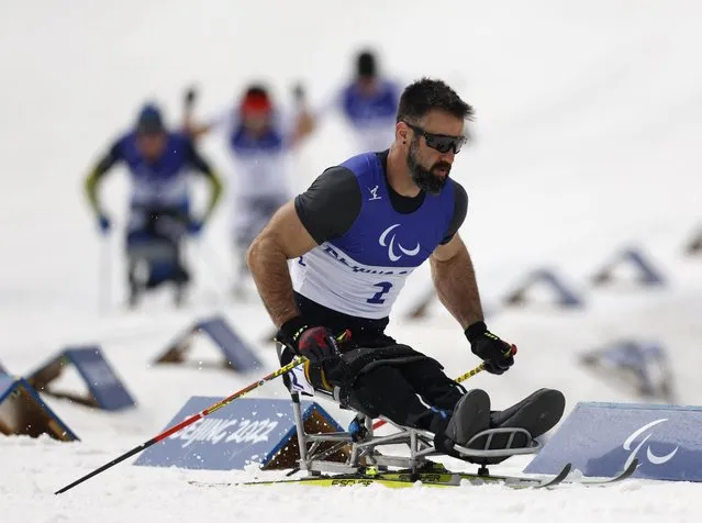 Canadas Collin Cameron competes during the mens cross country sprint free sitting final on March 9, 2022 at the Zhangjiakou National Biathlon Centre, during the Beijing 2022 Winter Paralympic Games. (Photo by Issei Kato/Reuters)