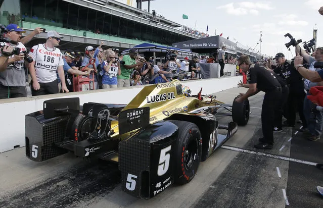 James Hinchcliffe, of Canada, celebrates after winning the pole for the Indianapolis 500 auto race at Indianapolis Motor Speedway in Indianapolis, Sunday, May 22, 2016. (Photo by Darron Cummings/AP Photo)