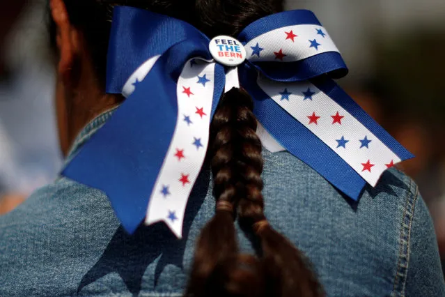 A supporter waits for U.S. Democratic presidential candidate Bernie Sanders to speak in East Los Angeles, California, U.S. May 23, 2016. (Photo by Lucy Nicholson/Reuters)