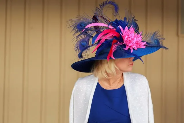A spectator shows off her Derby hat on the day of the 148th Thurby, the Thursday before Kentucky Derby at Churchill Downs in Louisville, Kentucky, U.S., May 5, 2022. (Photo by Amira Karaoud/Reuters)