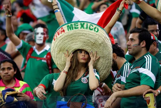 Mexico's fans celebrate after the group A World Cup soccer match between Croatia and Mexico at the Arena Pernambuco in Recife, Brazil, Monday, June 23, 2014. Mexico won 3-1. (Photo by Ricardo Mazalan/AP Photo)