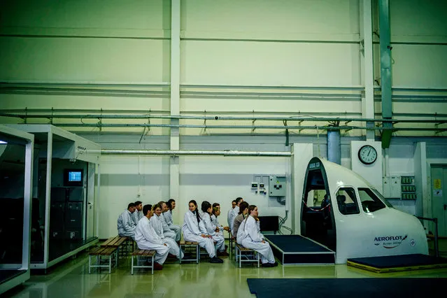 A flight staff practise emergency landing techniques at the Russian “Aeroflot” company Training Complex of the Aviation Personnel Training Center for search-and-rescue training “LAND-WATER” at Sheremetevo airport outside Moscow on December 25, 2019. (Photo by Dimitar Dilkoff/AFP Photo)