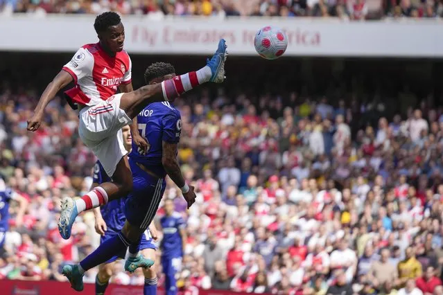 Arsenal's Eddie Nketiah, left, controls the ball during the English Premier League soccer match between Arsenal and Leeds United at the Emirates Stadium, in London Sunday, May 8, 2022. (Photo by Frank Augstein/AP Photo)